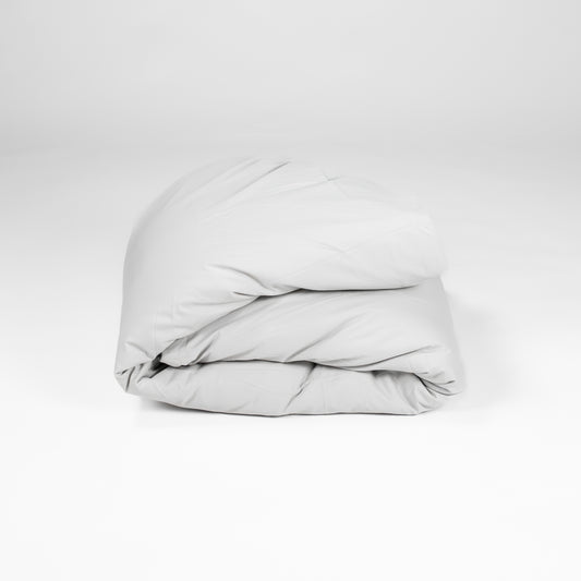 Organic cotton duvet cover folded up in grey